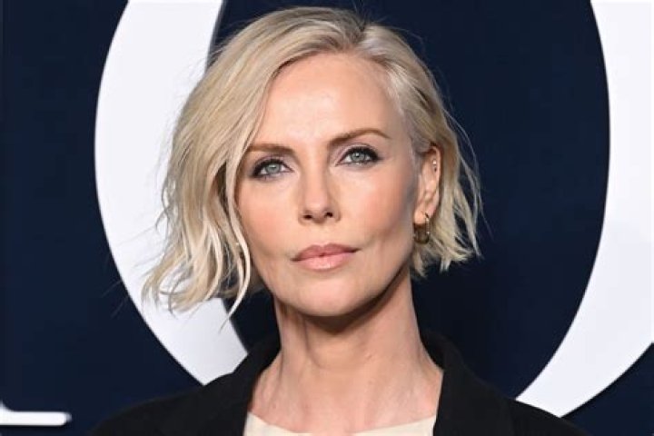 Charlize Theron can curse just a good as the boys, and reveals her new