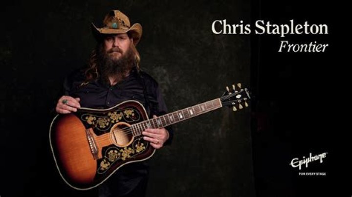 Chris Stapleton holding a stanley heavy duty steel ((staple gun)) AI