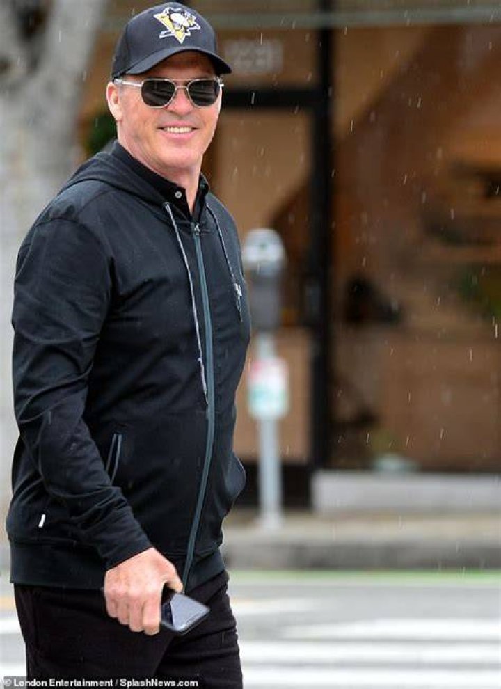 Michael Keaton, 68, looks cheery as he stocks up on groceries with his