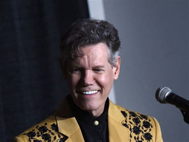 Randy Travis' stagehand 'shot dead by wife' on their porch over