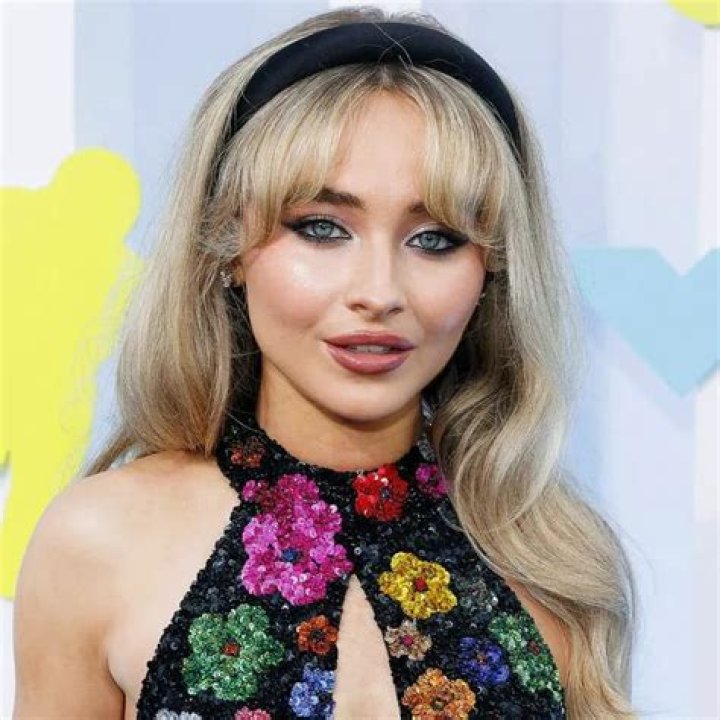 Sabrina Carpenter Simmers On Screen In A Black Crop Top And Micro Mini