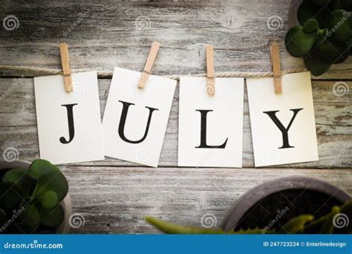 the word july written in red, white and blue fireworks